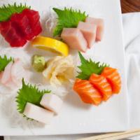Sashimi Plate · Three pieces of tuna, three pieces of salmon, three pieces of yellow tail, three pieces of f...