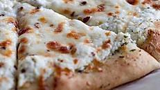 White Pie (Medium) · A pizza with white sauce.