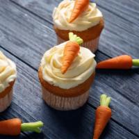Carrot Cupcake · Sweet and moist spice cake, full of cut carrots.