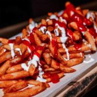 Mean Fries · Fries topped with white and red sauce.

PS: The sauces make them mean! 

Ingredient:Potato, ...