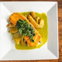 Salmon · Roasted salmon, fingerling potatoes, garlic spinach, basil, and coconut sauce.
