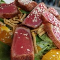Asian Tuna Salad · Mixed greens, tomato almonds, mandarin oranges, sesame seeds, crispy noodles, seared rare tu...
