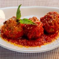 Polpette Al Sugo  · Beef meatballs with tomato sauce, basil, and parmesan cheese