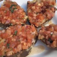 Bruschetta Al Pomodoro · Bread toasted with cherry tomatoes, basil, and olive oil