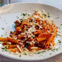 Penne Alla Norma · Tomato sauce with eggplant and topped with ricotta salata cheese