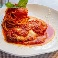 Pollo Alla Parmigiana · Fried chicken breast with mozzarella cheese and tomato sauce with spaghetti