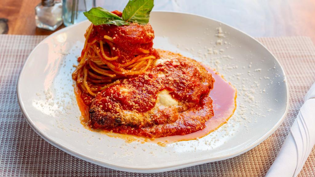 Pollo Alla Parmigiana · Fried chicken breast with mozzarella cheese and tomato sauce with spaghetti