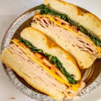 Turkey Florentine Sandwich · Turkey, spinach, cheddar cheese and tomato.