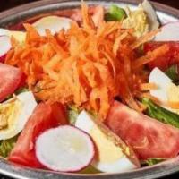Ensalada Buenos Aires / Buenos Aires Salad · Lettuce, tomatoes, carrots, radish, hard boiled eggs, olive oil and vinegar dressing.
