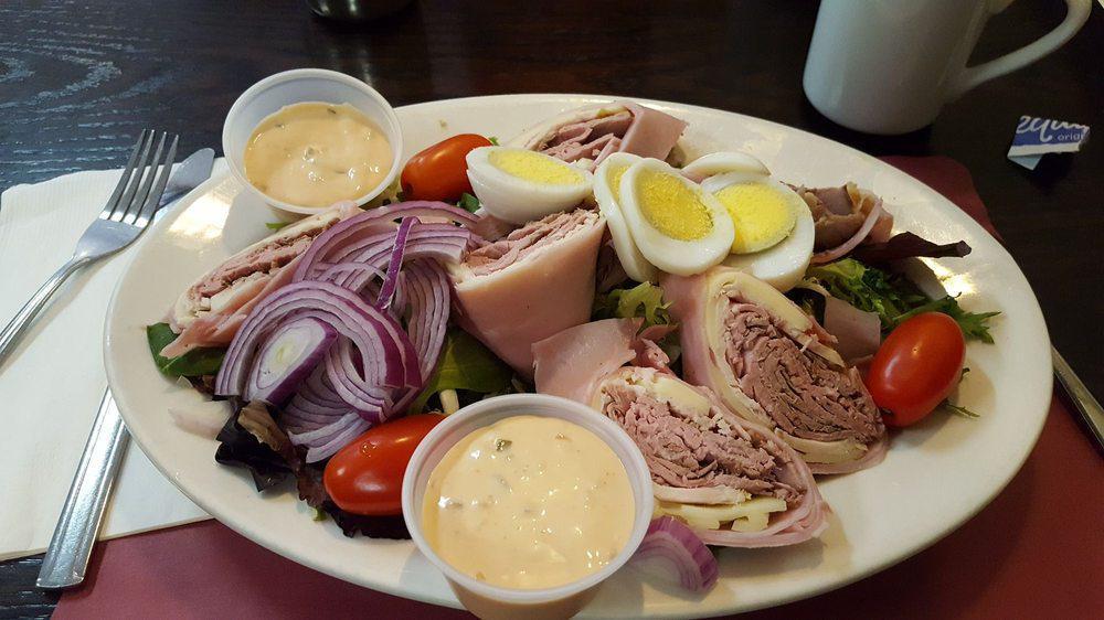 Chef Salad · Crisp lettuce, roast beef, ham, turkey, swiss, boiled egg and tomato with choice of dressing.
