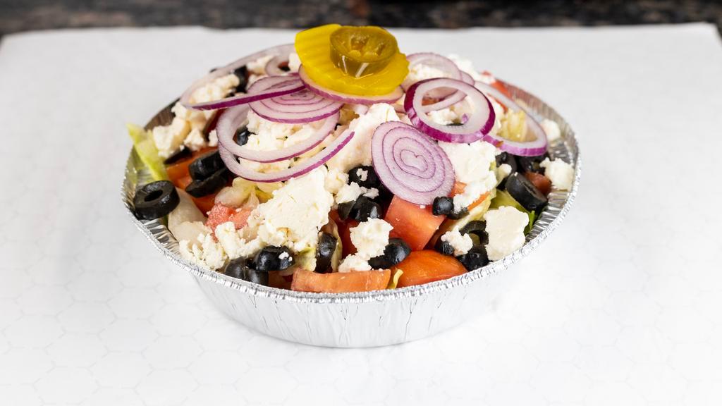 Greek Salad · Fresh greens, tomatoes, olives, red onions, cucumbers and feta cheese with a creamy Greek dressing.