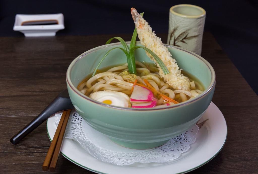 Nabe Yaki Noodles · Noodle soup with chicken, vegetable, egg, and one piece of shrimp tempura.