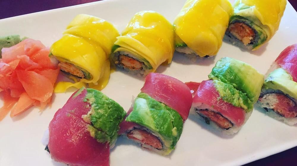 Lobster Mango Roll · Spicy crunchy lobster roll topped with slices of fresh mango and avocado.