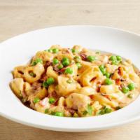 Carbonara Pasta · Bacon, Onions & Peas in a Parmesan Cream Sauce with Your Choice of Pasta