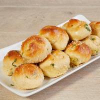 Garlic Knots · Tossed with Garlic, Oil, Parmesan Cheese & Fresh Parsley. Melted Mozzarella Available