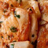 Brick Chicken · Roasted chicken, baked potatoes grain, lemon butter sauce
