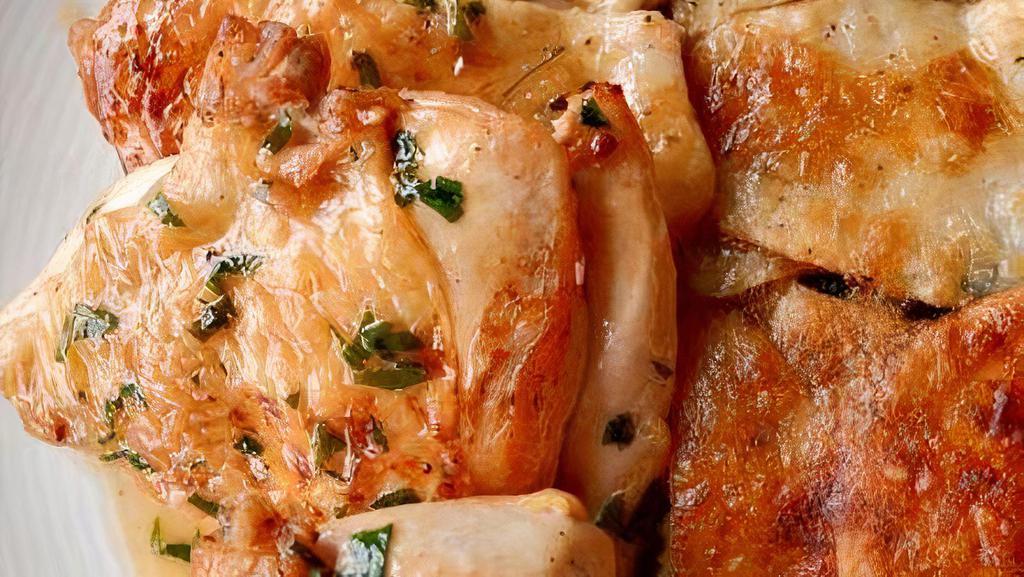 Brick Chicken · Roasted chicken, baked potatoes grain, lemon butter sauce