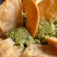 Guacamole · Made fresh daily served with seasoned pita chips.