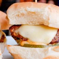 Mini Burgers · 3 seasoned all beef sliders, pickle-Mayo sauce, American cheese.