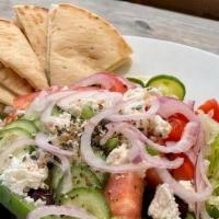 Greek Salad · Romaine lettuce, tomatoes, cucumbers, onions, bell peppers, kalamata olives, feta cheese, ex...