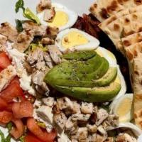 Tru Cobb Salad · Chopped romaine lettuce, tomatoes, hard boiled eggs, avocado, smoked bacon, feta cheese, gri...