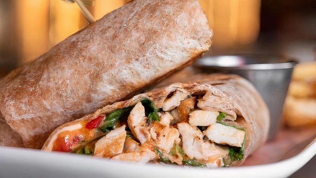 Grilled Chicken Wrap · seasoned chargrilled chicken breast, fresh mozzarella, baby arugula, roasted red peppers, sun dried tomato aioli.