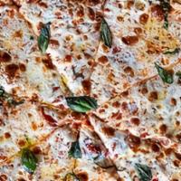 Margherita Pizza · Fresh Mozzarella, Basil, homemade pizza sauce.