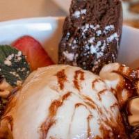 Brownie Sundae · Sliced brownie & strawberries with a scoop of vanilla ice cream, whipped cream, chocolate sy...