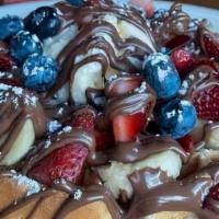 Dessert Waffle · Waffles topped with banana, blueberries, strawberries, nutella, and scoop of vanilla ice cre...