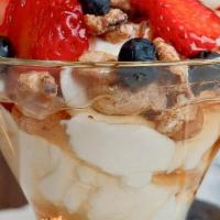 Greek Yogurt · Greek Yogurt topped with natural honey, nuts, and berries