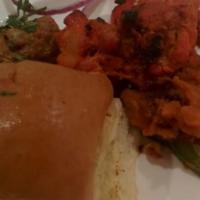 Pav Bhaji · A popular Indian street food consisting of a spicy blend of mashed vegetables served with bu...