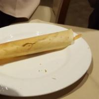 Masala Dosa · Thin crepe filled with mashed potato, onion, green peas and cashew nuts. Vegan.