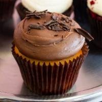 Vanilla-N-Chocolate · Vanilla cake topped with our chocolate buttercream and dark chocolate shavings.