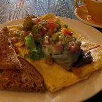 Avocado Omelet · Free range eggs, roasted sweet peppers, onions, avocado mash, tomato, cucumber, mix greens, ...