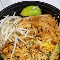 Pad Thai · Stir-fried Thai rice noodles with brown tofu, eggs, bean sprouts, scallions and crushed pean...
