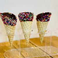 Fiesta Waffle Cone · Waffle Cone dipped in chocolate and covered with Rainbow Sprinkles.
