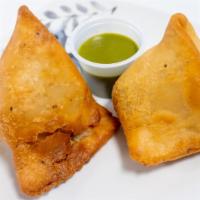 Veg Samosa (2 Pieces) · Crispy pastries filled with potatoes, peas and spices. Served with chutney of your choice - ...