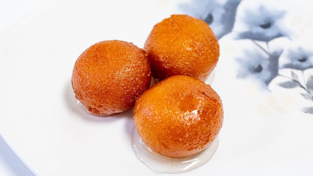 Gulab Jamun · Gulab jamun is a well-known and popular Indian dessert made of fried dough balls. A type of dumpling, gulab jamun is soaked in a sweet, sticky syrup.