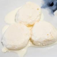 Rasmalai · Rasmalai is a creamy and milky syrup that consists of cottage cheese (chenna) balls. The syr...