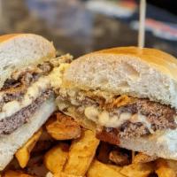 Curd Is The Word Burger · This double smash burger is stuffed  with delicious cheese curds and topped with our house g...
