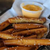 Pretzel Fries · Served with our homemade cheese sauce, perfect for dipping