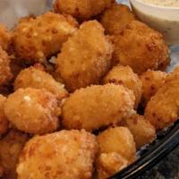 Spicy Cheese Curds · Breaded cheese curds with a hint of heat, fried golden brown served with a side of ranch for...