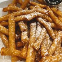 Funnel Cake Fries · Fried dough pieces in french fry shape and topped with powdered sugar. Optional dipping sauc...