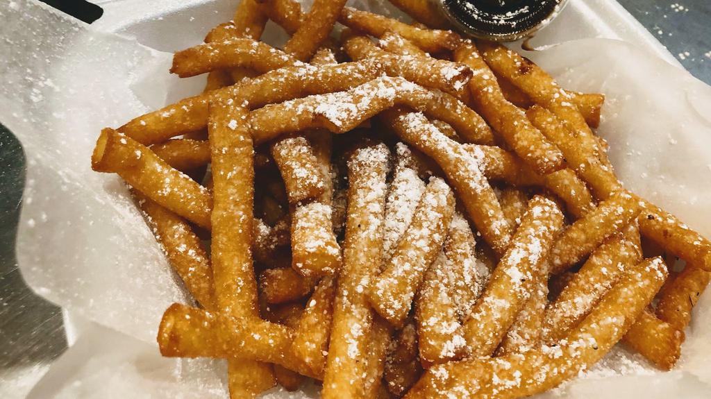 Funnel Cake Fries · Fried dough pieces in french fry shape and topped with powdered sugar. Optional dipping sauce available