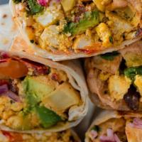 Veggie Wrap · Two fluffy scrambled eggs, sautéed onions, peppers, tomatoes and mushrooms in a gourmet spin...