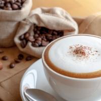 Cappuccino · Rich, dark espresso with steamed milk foam.