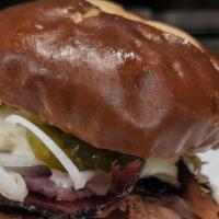 Johnny 2.0 · Fried Chicken topped with hot Pastrami, pickles, garlic mayo on pretzel bun