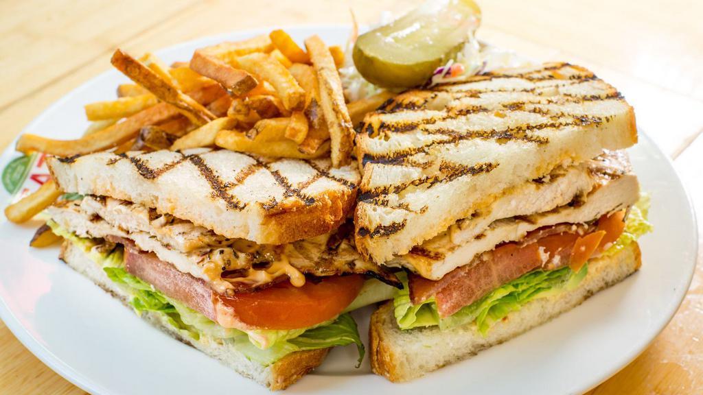 Grilled Chicken Sandwich · on grilled sourdough, with avocado, bacon, chipotle mayo, romaine and beefsteak tomato . Served with fries and slaw.