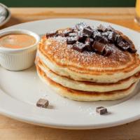 Pancakes With Warm Maple Butter · Choose wild Maine blueberry, banana walnut or chocolate chunk.