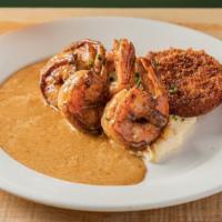 Spicy Shrimp & Grits · with fried green tomatoes, creamy creole sauce, and white corn grits